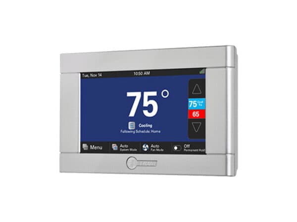 Trane touchscreen thermostat displaying temperature and system controls.